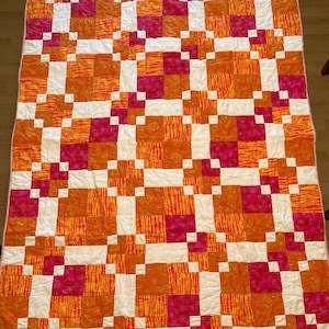 Vibrant Orange and Pink Quilt