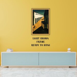 May include: A framed art print depicting a stylized street scene with a figure in motion. The artwork is in a light brown frame and is ready to hang. The text below the frame reads "LIGHT BROWN FRAME READY TO HANG".