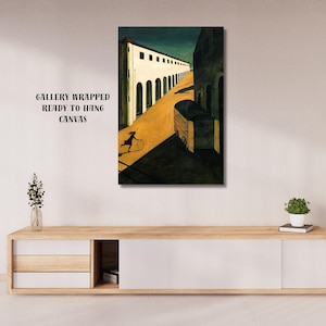 May include: A canvas print of an architectural scene with a figure rolling a hoop. The artwork features a long white building with arched windows and a yellow road. The text "GALLERY WRAPPED READY TO HANG CANVAS" is visible.