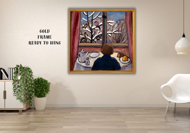 May include: A framed painting depicts a person gazing out a window at a snowy landscape with birds. A table is set with a teapot, plate, and food. The painting is in a gold frame. Text on the frame reads: GOLD FRAME READY TO HANG.