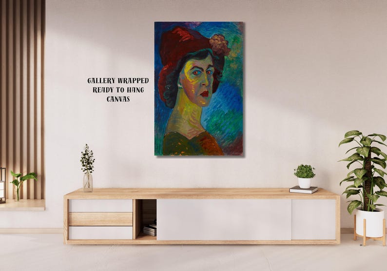 May include: A gallery-wrapped canvas print of a portrait of a woman wearing a red hat with a flower. The artwork features a colorful, impressionistic style with blue, green, and yellow hues. The text "GALLERY WRAPPED READY TO HANG CANVAS" is visible.