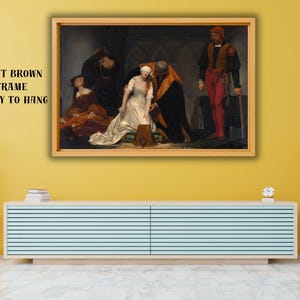 May include: A framed print of a historical painting. The artwork depicts several figures in a dimly lit interior, with a central figure in a white dress. The frame is light brown, and the text "LIGHT BROWN FRAME READY TO HANG" is visible.