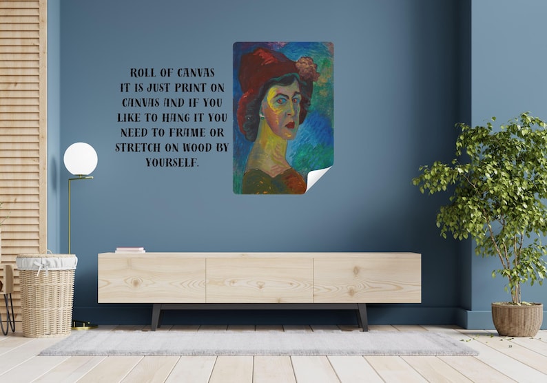 May include: A print on canvas of a woman in a red hat, with text that reads "ROLL OF CANVAS IT IS JUST PRINT ON CANVAS AND IF YOU LIKE TO HANG IT YOU NEED TO FRAME OR STRETCH ON WOOD BY YOURSELF."
