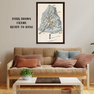 Op de afbeelding: Een ingelijst kunstwerk met een donkerbruine lijst. Het kunstwerk toont een surrealistische sc&egrave;ne van menselijke benen die uit een blauwgrijze rotsformatie komen. Een klein rood figuur staat eronder. De tekst op de muur luidt "DARK BROWN FRAME READY TO HANG."