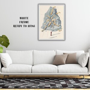 Op de afbeelding: Een ingelijste kunstdruk met een surrealistische illustratie. Het kunstwerk toont een grote, grijze rotsformatie met losgemaakte ledematen. Een klein figuur staat eronder. De lijst is wit en de tekst "WHITE FRAME READY TO HANG" is zichtbaar.