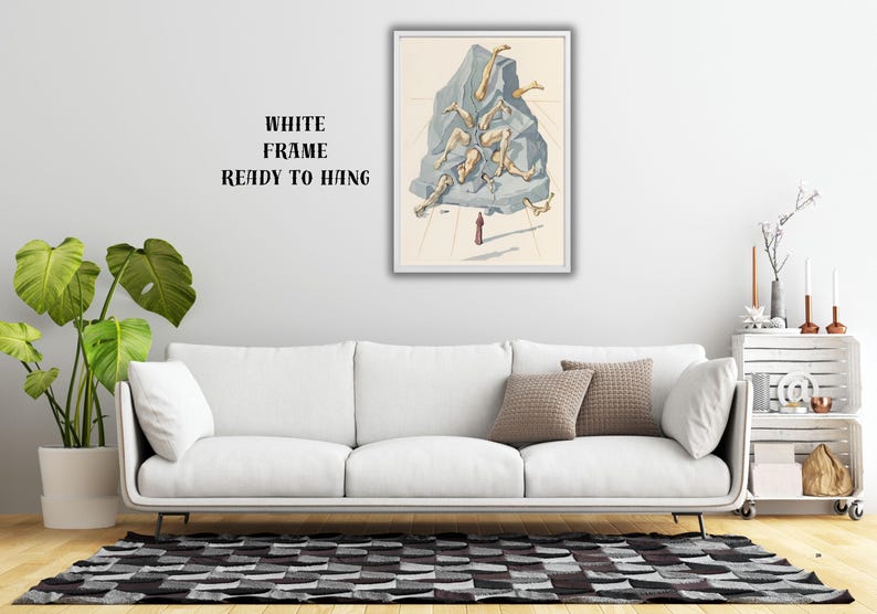 Op de afbeelding: Een ingelijste kunstdruk met een surrealistische illustratie. Het kunstwerk toont een grote, grijze rotsformatie met losgemaakte ledematen. Een klein figuur staat eronder. De lijst is wit en de tekst "WHITE FRAME READY TO HANG" is zichtbaar.