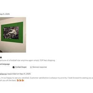 The image is a wall art piece featuring a football player in mid-action. The wall art is green and hangs on a white wall. The image is described as a "Wonderful picture of a football star again simply TOP fast shipping" and is "See in original language". The image also includes a rating of 5 stars and a response from a customer named Catherine, who says she is happy to see satisfied customers and customer satisfaction is always her priority.