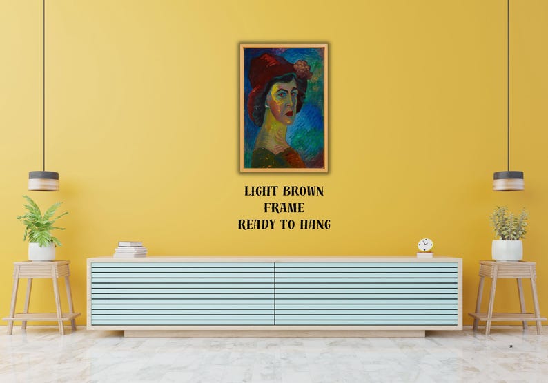 May include: A framed portrait of a woman wearing a red hat, with a light brown frame. The painting features a colorful, impressionistic style. Text below the frame reads "LIGHT BROWN FRAME READY TO HANG".