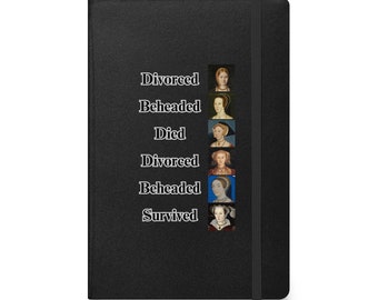 May include: A black notebook with a black elastic band closure. The front cover features a list of words: "Divorced", "Beheaded", "Died", "Divorced", "Beheaded", "Survived". Each word is paired with a portrait of a woman.