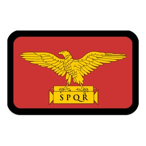 May include: A rectangular patch featuring a golden eagle with outstretched wings, centered on a red background. Below the eagle is a banner with the letters SPQR. The patch has a black border.