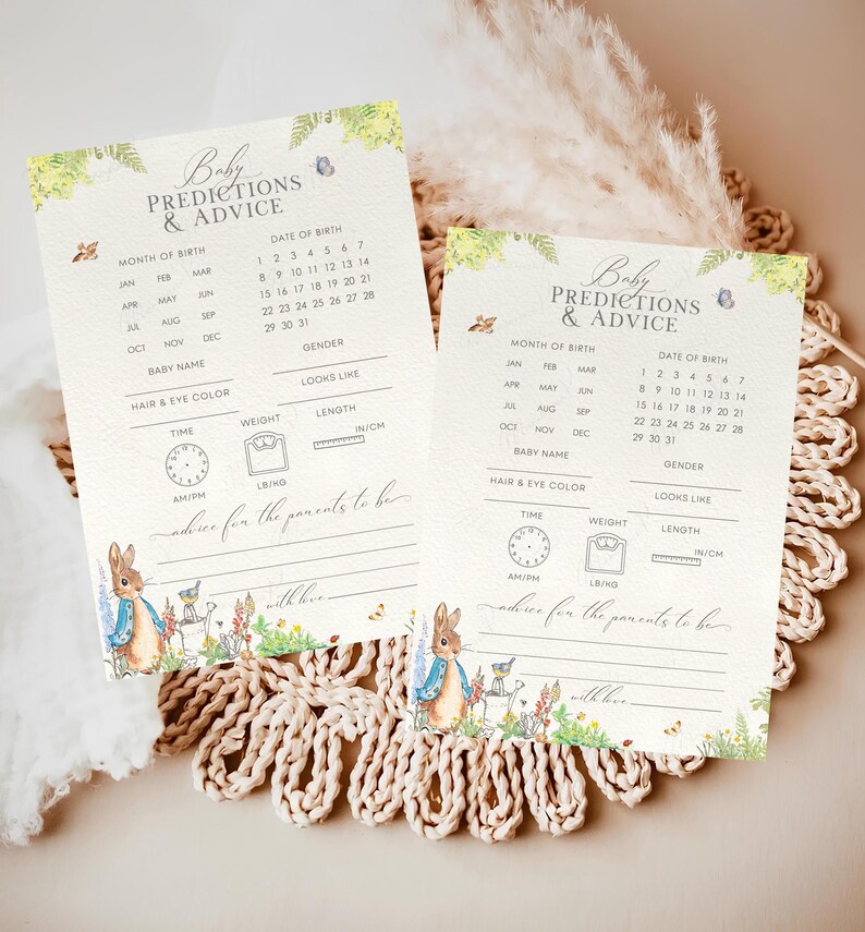 May include: Two printable baby shower game cards featuring a Peter Rabbit theme. The cards have a light blue and green floral design with a Peter Rabbit illustration. The cards include a list of predictions for the baby, such as the month of birth, date of birth, gender, baby name, hair and eye colour, looks like, time of birth, weight, and length.