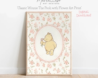 May include: A digital printable art print featuring Winnie the Pooh smelling a pink flower. The background is a white floral pattern with pink flowers and green leaves. The text 'Classic Winnie The Pooh with Flower Art Print' and 'Digital Download!' is included in the image.