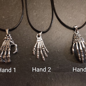 Silver Skeleton Hands Necklace -  UK