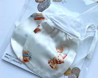 A pair of Silk Anti-Scratch Baby Mittens. Helps with soothing eczema, irritated skin