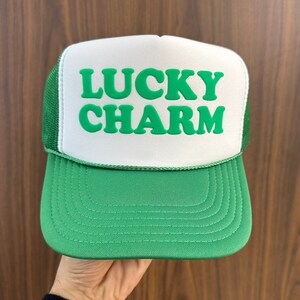 a green and white lucky charm trucker hat