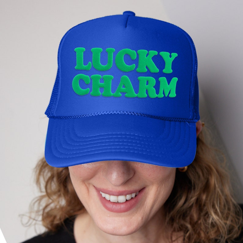 a woman wearing a blue lucky charm hat