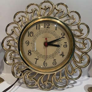 Vintage Gold Tone Starburst Clock - United Model 80.  Tested Working