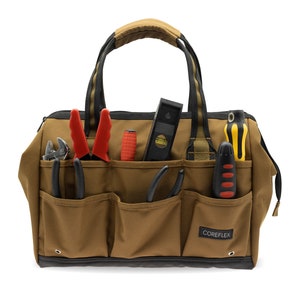 May include: A brown canvas tool bag with multiple pockets, filled with tools including pliers, screwdrivers, a level, and a utility knife. The bag has a black handle and the text "COREFLEX" is printed on the front.