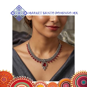 May include: A white ceramic mug with a black handle and the text "But first, coffee" in a black, handwritten-style font. The mug is on a white surface.