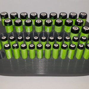 Battery holder for AA and AAA batteries
