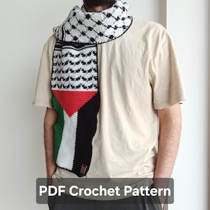 May include: A crochet scarf featuring a black and white keffiyeh pattern on the upper section and the colors of the Palestinian flag, including red, green, white, and black, on the lower section. The text PDF Crochet Pattern is visible.