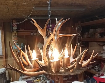 Real Antler Chandelier Ceiling pendant 25 inch diameter. Real antlers four lights log cabin decor. Rustic country living design.