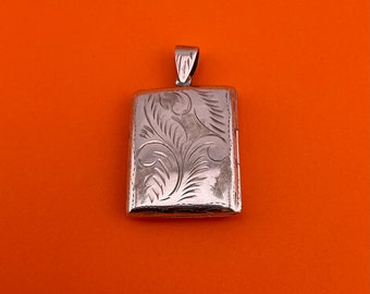 Silver vintage rectangle/book shaped locket