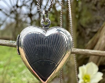 Silver heart sunburst locket