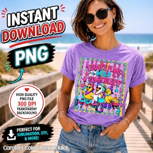 May include: A light purple t-shirt featuring a graphic print of three yellow ducks on roller skates with the text "TODAY'S PLANS: MILD TOMFOOLERY!" surrounded by colorful stars, flowers, and vertical stripes in a vibrant, multi-colored design.