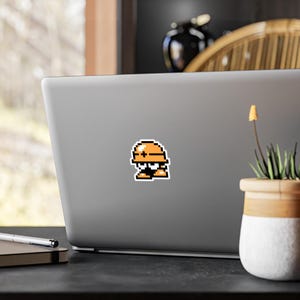 8-Bit Met Vinyl Decal Sticker,  Mega Man Pixel Art Nostalgia, 80&#39;s Gaming Decor, Retro Gamer Laptop Decal, Video Game Wall Art (Facing Left)