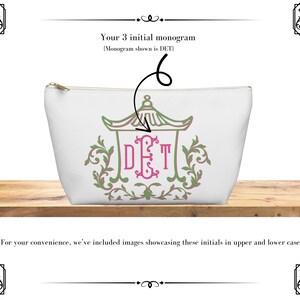 May include: White cosmetic bag with a gold zipper, featuring a green and pink pagoda design with the initials DET. The bag is sitting on a wooden surface. Text above reads "Your 3 initial monogram".