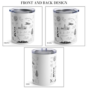 May include: White stainless steel tumbler with a black and white design featuring various landmarks and symbols of North Carolina. The text "The Tar Heel State" is printed on the tumbler.