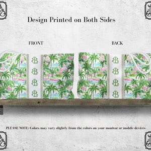 May include: Tote bag with a tropical design featuring palm trees, pink flamingos, and a light blue water scene. The bag has white rope handles and a vertical stripe with a repeating anchor symbol. The text "Design Printed on Both Sides" is visible.