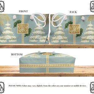 May include: A light blue tote bag with white rope handles, featuring a repeating pattern of white floral designs and gold accents. The bag has a rectangular shape with a Greek key border design.