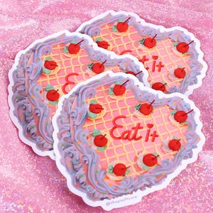 Vintage style cake that says eat it sticker.