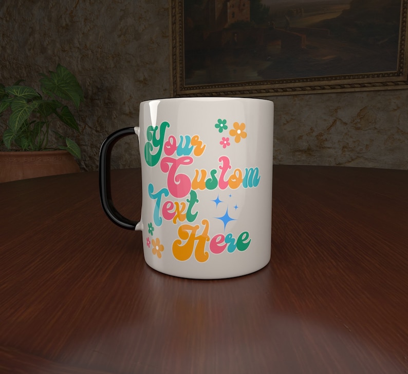 May include: White ceramic mug with a black handle. The mug has a colorful retro design with the text "Your Custom Text Here" and flowers.