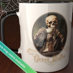 May include: White ceramic coffee mug with a black handle. The mug features a graphic of a skeleton in a suit drinking from a teacup. The text "Never Better" is printed below the image.
