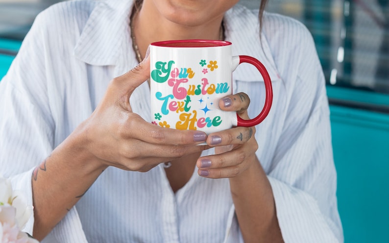 May include: White ceramic mug with a red rim and handle. The mug has a colorful design with the text "Your Custom Text Here" in a retro font.