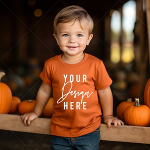 Cute Toddler T-Shirt Mockup Baby Boy, RABBIT SKINS 3322 Orange Mockup with Model, White T-Shirt Cute Toddler Pumpkin patch Outside POD