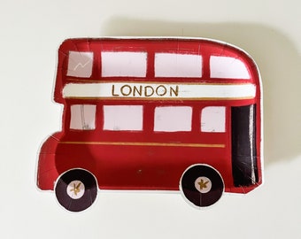 May include: Red and white paper plate shaped like a double-decker London bus with the word "LONDON" printed on the side.