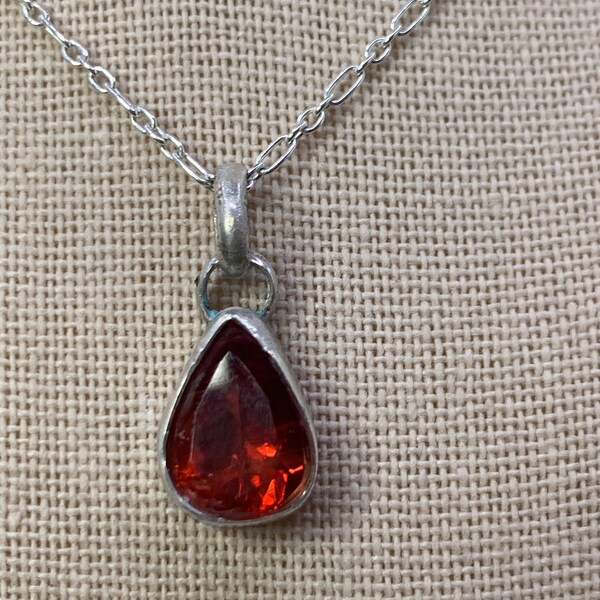 Rare Cherry Red Sunstone. 2.52 carat pendant set in a handmade, sterling silver setting. This is eye catching and magnificent.