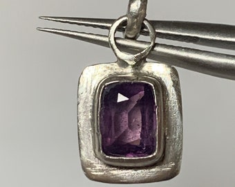 Purple sapphire pendant, emerald cut. 1.08 carats set in a handmade, sterling silver, setting.
