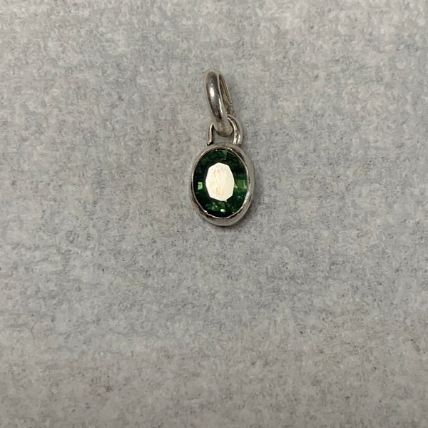 Green sapphire. 1.65 carats set in a handmade, sterling silver pendant.