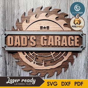 May include: Wooden sign with the text "DAD'S GARAGE" in a layered design. The sign is shaped like a saw blade and features the words "Laser ready" and file type options: SVG, DXF, and PDF.