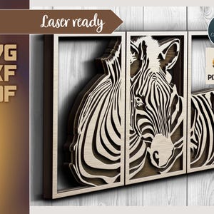 Könnte beinhalten: Lasergeschnittenes Design von zwei Zebras, eines mit dem Kopf zur Seite gedreht und das andere mit dem Kopf zum ersten Zebra gedreht. Die Zebras sind in Schwarz-Weiß-Streifen gehalten und vor einem Holzgrund platziert. Das Design ist mit "Laser ready" und "Pixelpablo" beschriftet.