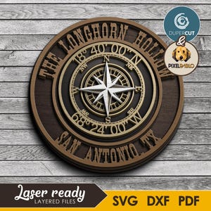 May include: A layered wooden sign with a compass design. The sign is circular with the text "THE LONGHORN HOLLOW SAN ANTONIO TX" around the edge. The compass rose is in the center, with the coordinates 18°40'00"N and 68°24'00"W. The sign also includes the text "Laser ready LAYERED FILES SVG DXF PDF".
