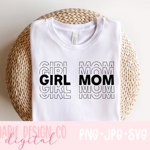 May include: White t-shirt with black text that reads "GIRL MOM" in a stacked, repeating pattern. The text is in a bold, sans-serif font.
