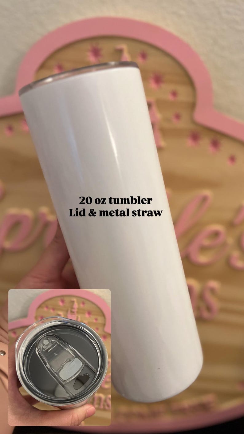May include: A white 20 oz tumbler with a smooth finish, featuring a clear plastic lid and a metal straw. The text 20 oz tumbler Lid & metal straw is printed on the side of the cylindrical container, which has a flat base and a circular opening.