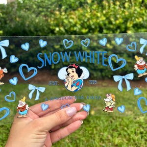 May include: A handmade wooden sign with the text "Welcome" in a handwritten style. The sign is painted white with a distressed finish and features a small, decorative heart. It is designed for indoor or outdoor use.