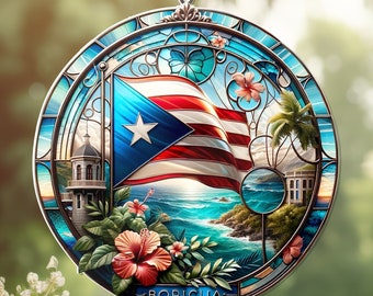 May include: A round, stained-glass suncatcher featuring the Puerto Rican flag, a white star on a blue triangle, and red and white stripes. The design includes coastal scenery, flowers, and the word "BORICUA". It hangs from a silver chain.